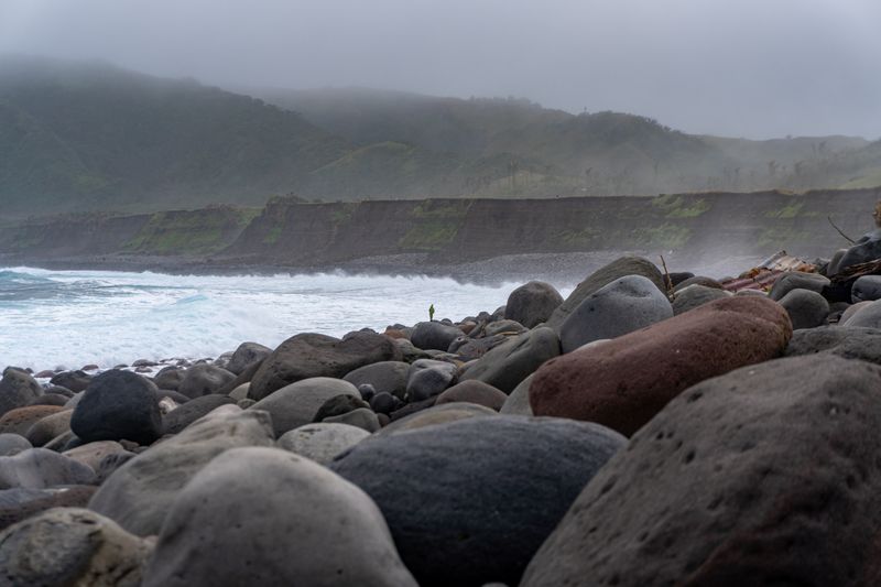 Chadpidan Boulder Beach, as seen from the Basco Rolling Hills vantage point earlier. The cliffs on the background are easily ten metres high. Gives a weird alpine terrain feel despite being tropical.