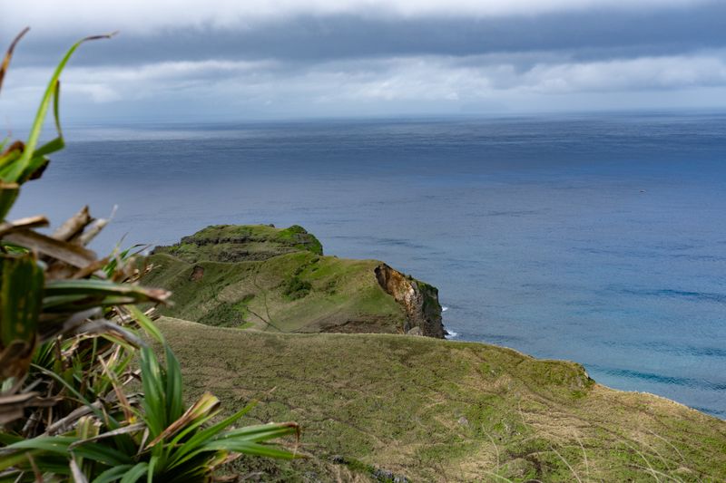 My actual mainstay wallpaper, on both my phone and my PC. The level of detail when you zoom in is nuts. A rock formation slowly eroding, being consumed by the sea. Note the small boat on the right: breezing through deceptively calm waters.
