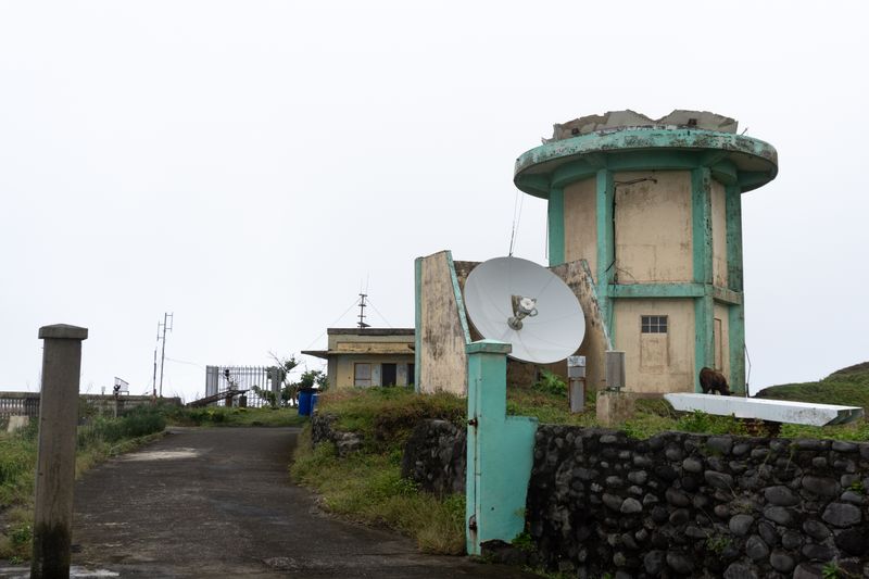 The ruined radar up-close. Overcast weather makes this feel more ominous. I cannot find reliable information on how this was destroyed.