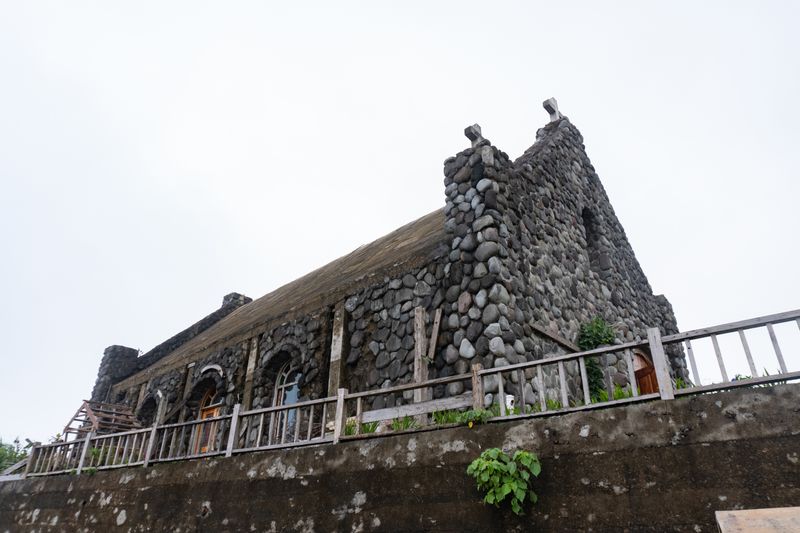 Tukon Chapel, standing alone in the hills under overcast clouds. It was under renovation when we went there.