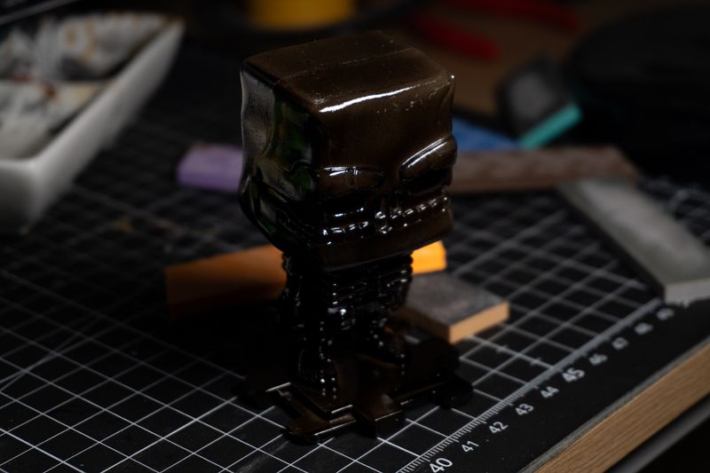 First step, a black base coat. Only had gloss black on hand and it was a bit hard to apply, with the lighter base plastic.