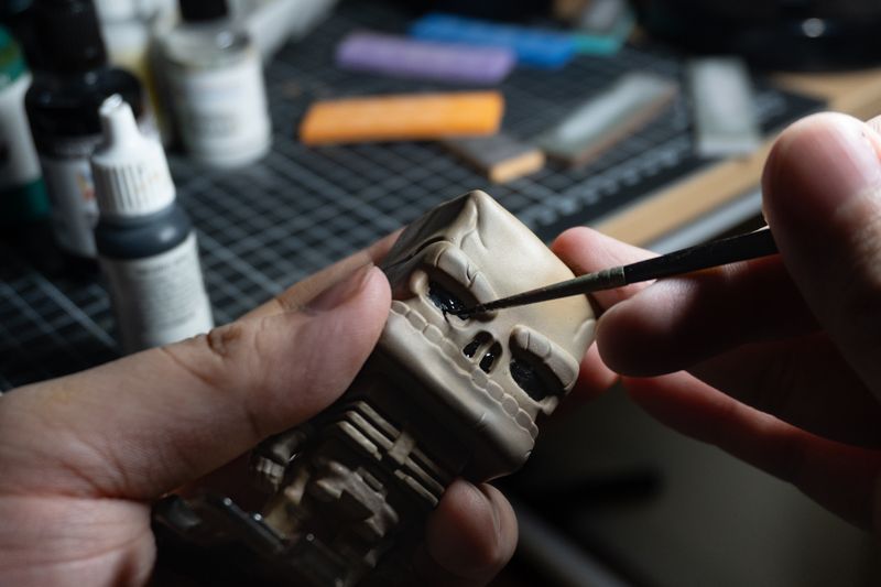 Painting in the eye and nose holes. Vallejo rubber black.